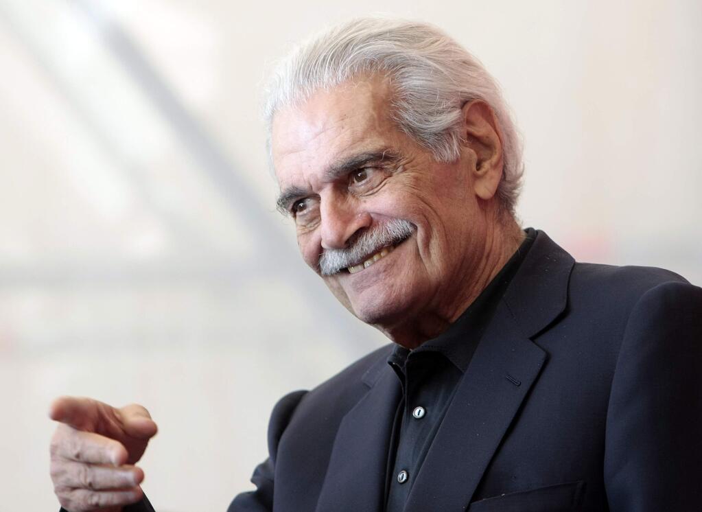 FILE - In this Thursday, Sept. 10, 2009 file photo, Egyptian actor Omar Sharif gestures during the photo call for the film 'Al Mosafer (The Traveller)' at the 66th edition of the Venice Film Festival in Venice, Italy. Sharif has died in a Cairo hospital of a heart attack, his agent said on Friday, July 10, 2015. (AP Photo/Andrew Medichini, File)