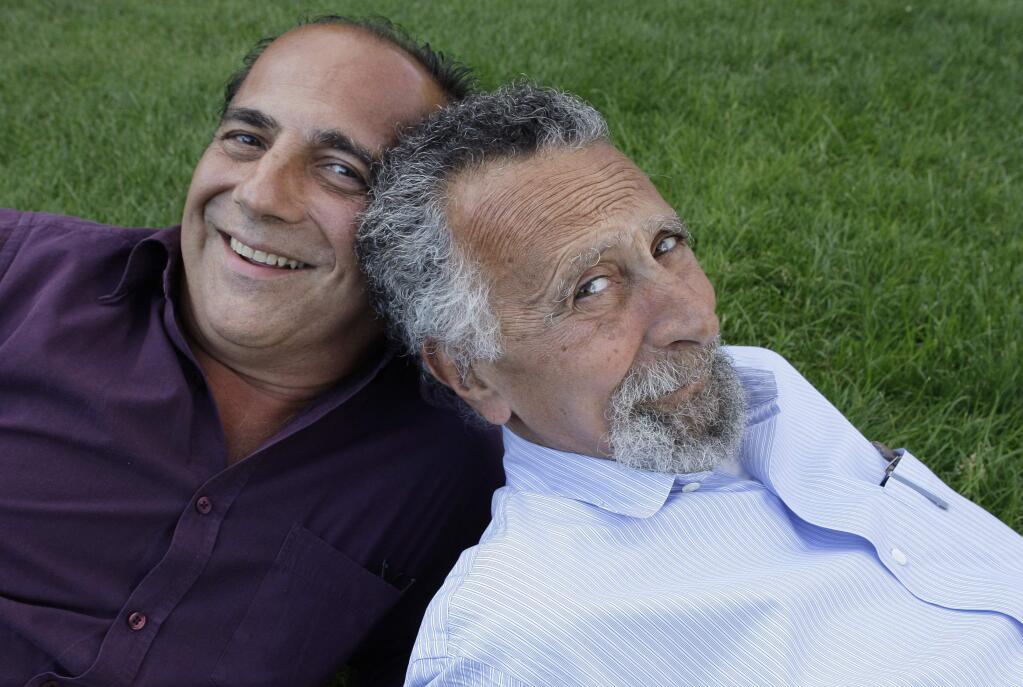 In this June 19, 2008 photo, brothers Ray, left, and Tom Magliozzi, co-hosts of National Public Radio's 'Car Talk' show, pose for a photo in Cambridge, Mass. NPR says Tom Magliozzi died Monday, Nov. 3, 2014 of complications from Alzheimer's disease. He was 77. (AP Photo/Charles Krupa)