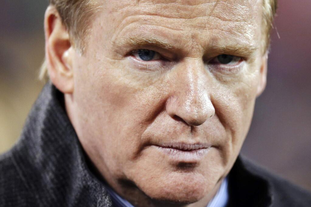 In t his Feb. 2, 2014, file photo, NFL Commissioner Roger Goodell takes the field before the NFL Super Bowl XLVIII football game between the Seattle Seahawks and the Denver Broncos in East Rutherford, N.J. (AP Photo/Ben Margot, File)