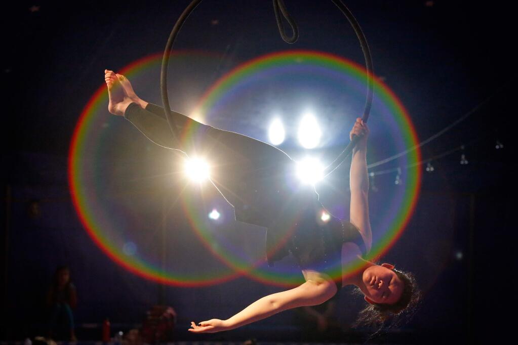 Summerfield Waldorf eighth grader Zara Keen practices her routine suspended on the lyra or hoop during rehearsal for Circus Waldissima at Summerfield Waldorf School and Farm in Santa Rosa, California on Friday, March 18, 2016. (Alvin Jornada / The Press Democrat)