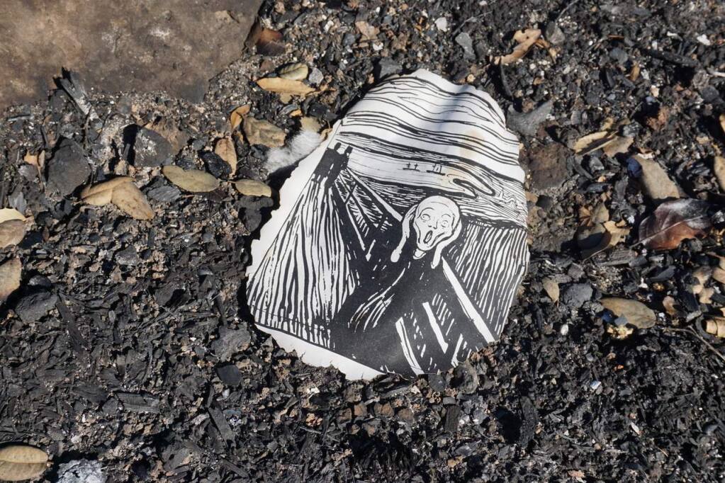 Josiah Wilcox found a burned page with an image of Edvard Munch's famous painting, “The Scream,” under a scorched bush in Fountaingrove. (Cy Wilcox photo)