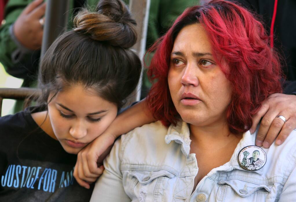Sujey Cruz, right, with her daughter Sujey Lopez, 15, after a memorial for son and brother Andy Lopez, who was killed three years ago by a Sonoma County Sheriff's Deputy at the future site of Andy's Unity Park in Santa Rosa. (John Burgess/The Press Democrat)