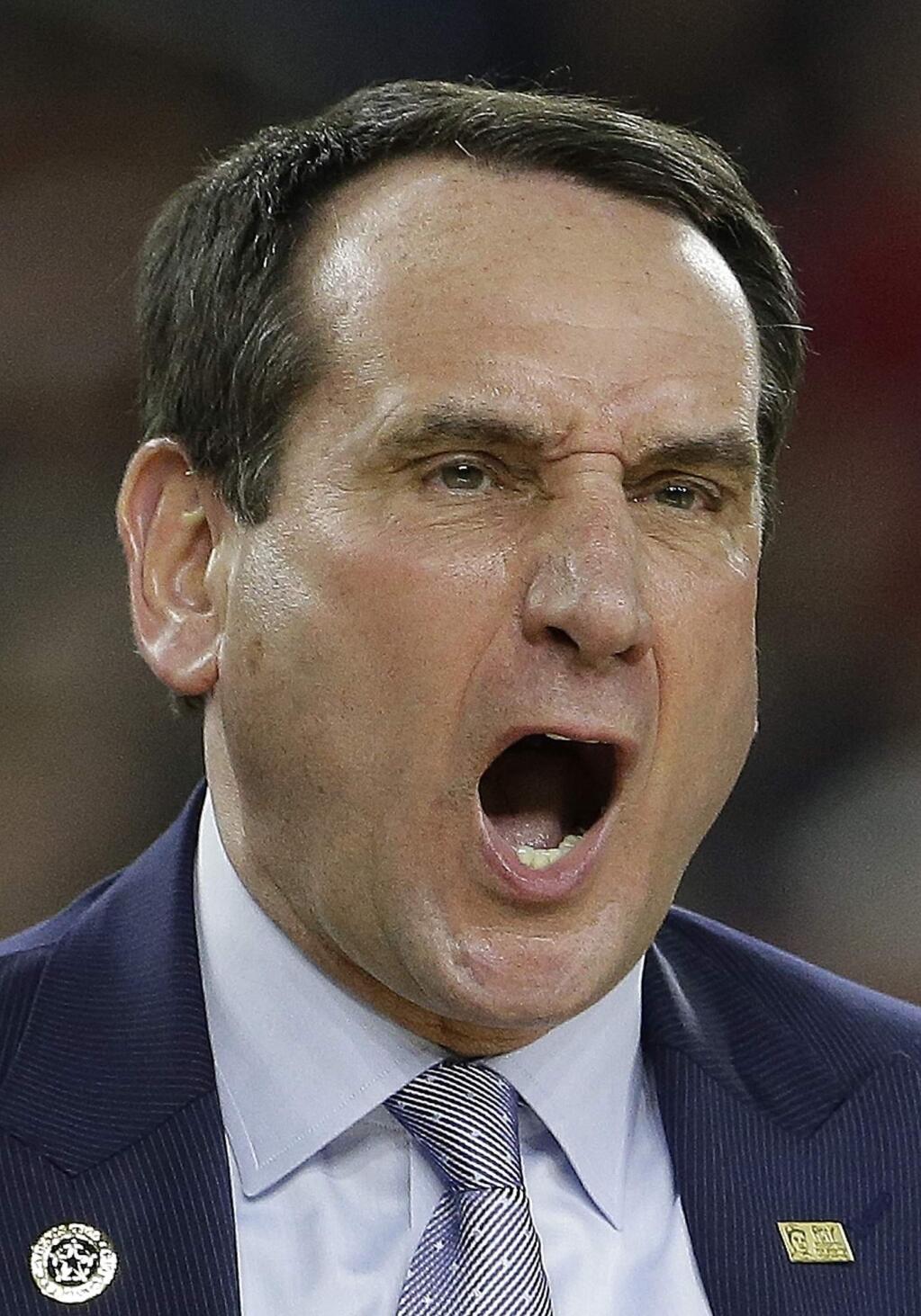 Duke head coach Mike Krzyzewski yells during the first half of a college basketball regional final game against Gonzaga in the NCAA Tournament Sunday, March 29, 2015, in Houston. (AP Photo/Charlie Riedel)