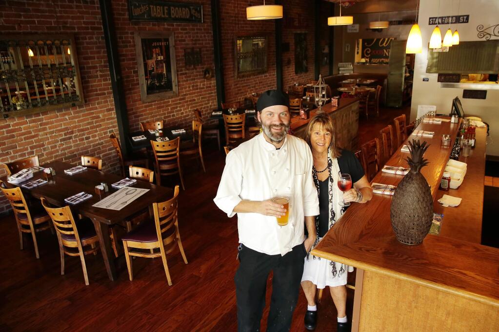 Chef Martin Maigaard and owner Shawn Hall enjoy at the Gypsy Cafe in Sebastopol on Friday, July 18, 2014. (Conner Jay/The Press Democrat)