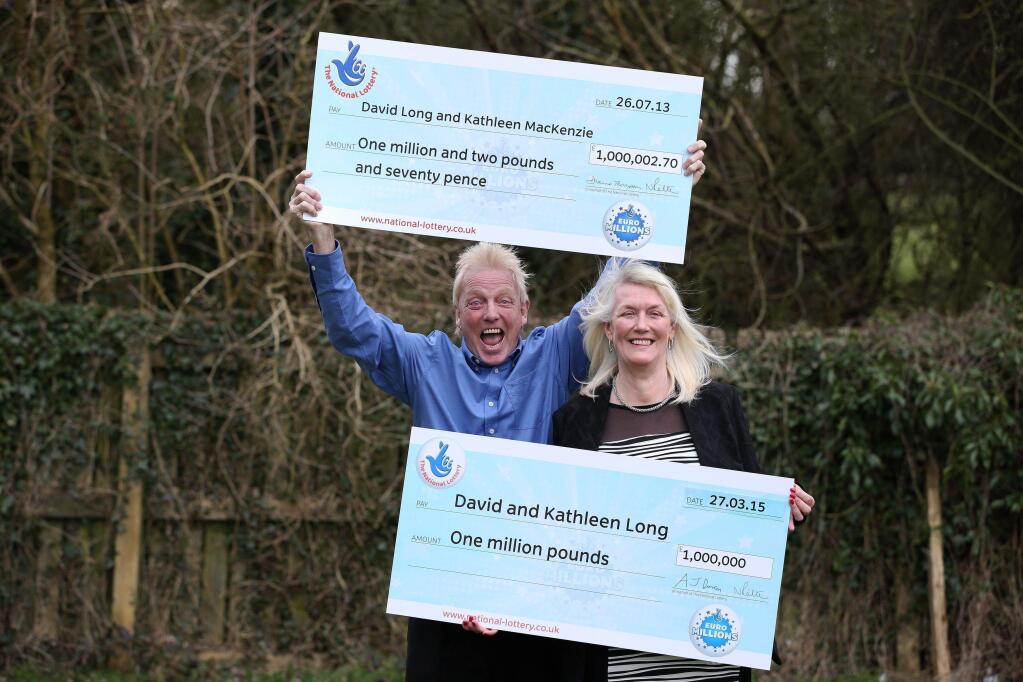 David and Kathleen Long pose for a photograph with their symbolic cheques from the British lottery at The Mallard in Scunthorpe, England. David and Kathleen Long won the prize in the EuroMillions Mega Friday Draw, having already scooped up 1 million pounds $1.5 million) in 2013. The couple also won a luxury car. Lottery operator Camelot said Wednesday the couple beat odds of 283-billion-to-1. (AP Photo/PA, Lynne Cameron)