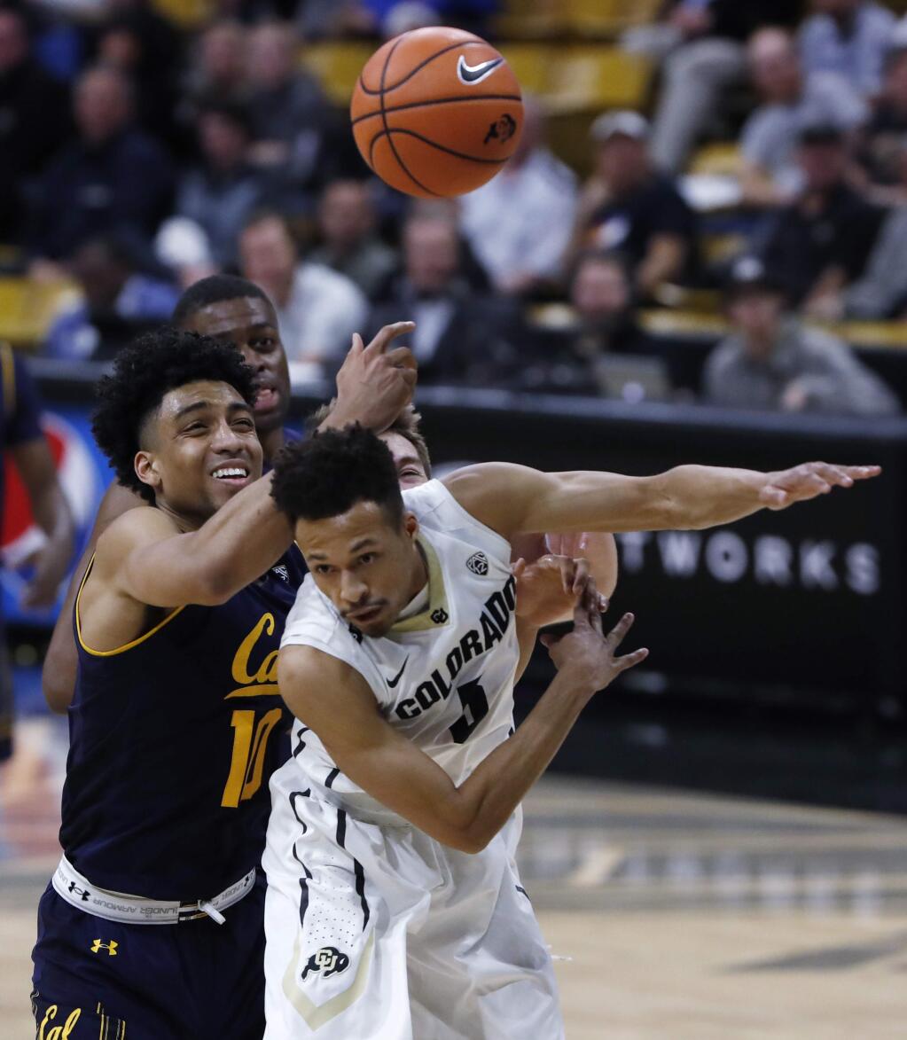 Cal forward Justice Sueing, left, vies for control of a rebound with Colorado guard Deleon Brown during the first half Wednesday, Feb. 7, 2018, in Boulder, Colo. (AP Photo/David Zalubowski)