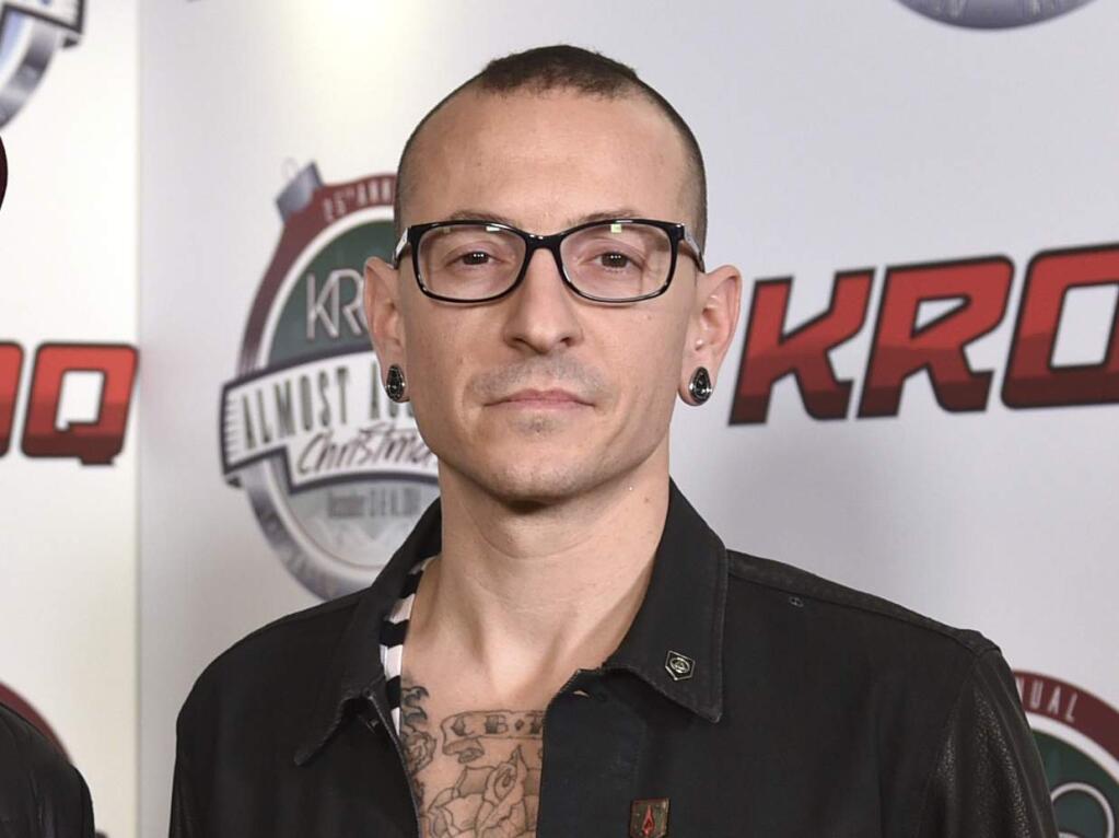 FILE - In this Dec. 13, 2014 file photo, Chester Bennington poses in the press room at the 25th annual KROQ Almost Acoustic Christmas in Inglewood, Calif. Warner Bros. Records said the Linkin Park singer's private funeral was held Saturday, July 30 in Los Angeles.Bennington was found dead in his home near Los Angeles on July 20. (Photo by John Shearer/Invision/AP, File)