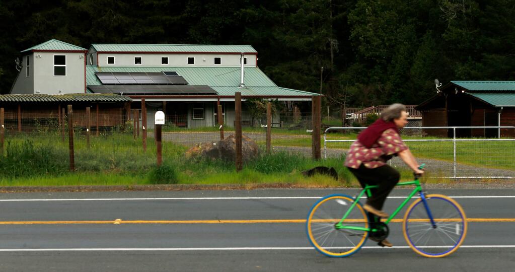A cyclist pedals along Armstrong Woods Road in Guerneville, California, on Friday, March 17, 2017. (ALVIN JORNADA/ PD)