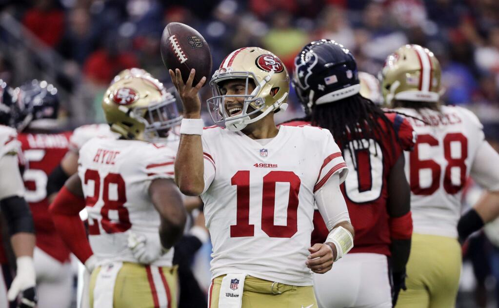 FILE - In this Dec. 10, 2017, file photo, San Francisco 49ers quarterback Jimmy Garoppolo (10) smiles after a play during the second half of an NFL football game against the Houston Texans, in Houston. After two straight wins on the road, Garoppolo gets ready for his first home start with the 49ers. (AP Photo/David J. Phillip, File)