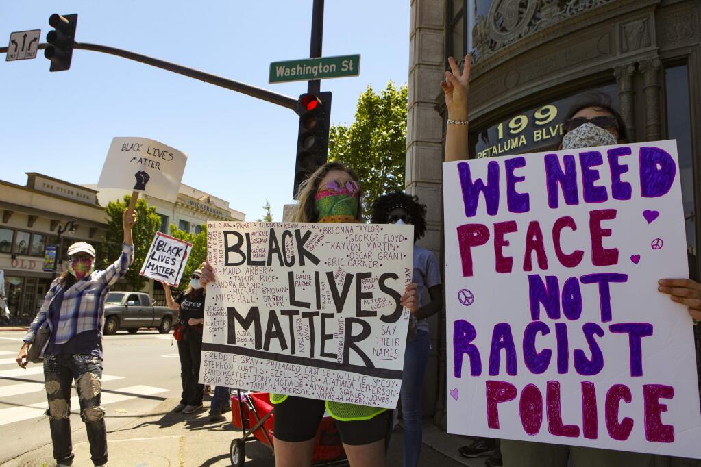 In this June 2020 Argus-Courier file photo, A crowd of Black Lives Matter supporters marched from Walnut Park through downtown Petaluma to the Police Department, chanting, cheering and holding signs protesting police brutality and racism spurred by the killing of George Floyd in the hands of Minneapolis police officers. (CRISSY PASCUAL/ARGUS-COURIER STAFF)