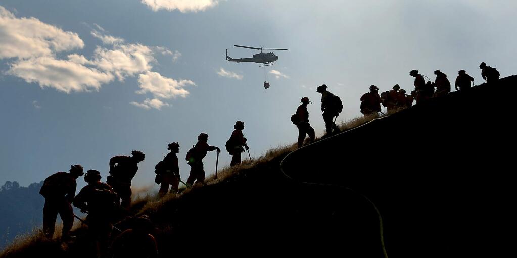 Inmate crews cut line around the Grape fire in Hopland, Tuesday Sept. 19, 2017. (Kent Porter / The Press Democrat) 2017