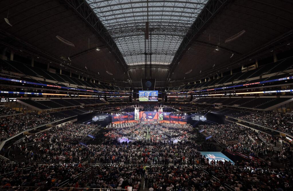 This April 26, 2018, file photo, shows a general overall view of AT&T Stadium as Georgia's Roquan Smith is selected by the Chicago Bears during the first round of the NFL draft, in Arlington, Texas. (AP Photo/David J. Phillip, File)