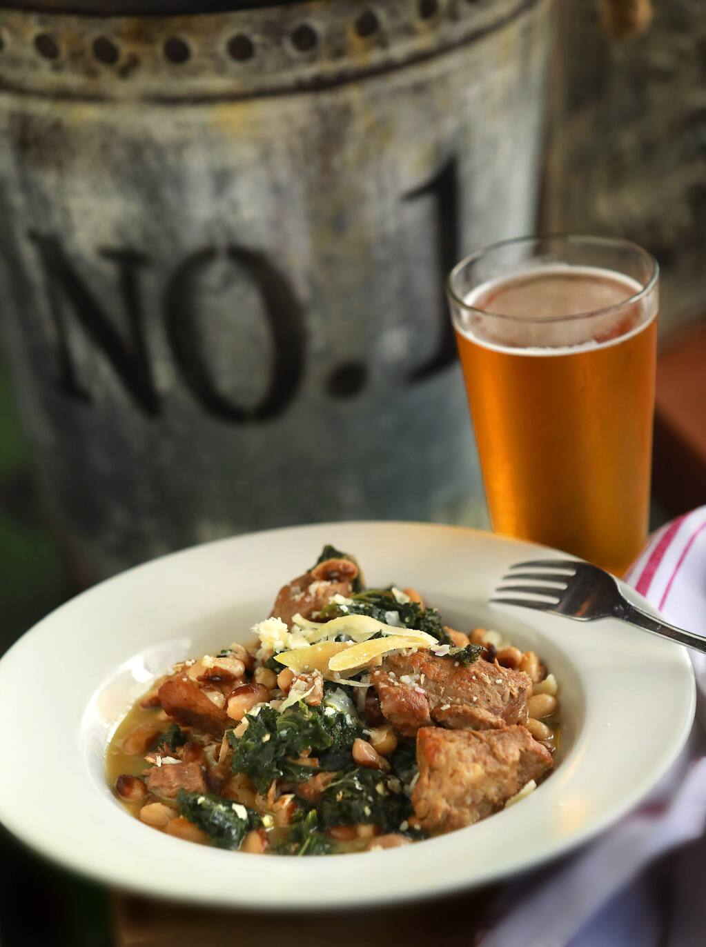 Pork and Heirloom Beans combines braised pork, rancho gordo heirloom yellow eye beans and greens from the Gypsy Cafe in Sebastopol. (John Burgess/The Press Democrat)