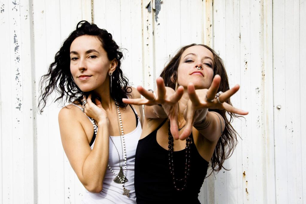 Rising Appalachia is a musical group from Atlanta led by multi-instrumentalist sisters Leah and Chloe Smith performing with a band which plays a wide variety of instruments in what they describe as ‘crunk-folk meets Deep South sister soul.' (CHRIS HESS)