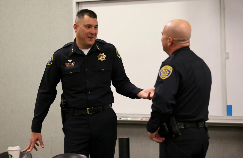 James Conner, Chief of the Sebastopol Police Department, left, and David Dougherty, Chief of the Sonoma State University Police Department, right, talk before a monthly meeting at the Sonoma County Sheriff's Office conference room in Santa Rosa on Thursday, March 7, 2019. (BETH SCHLANKER/ The Press Democrat)