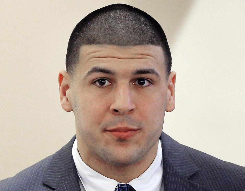 FILE - In this April 1, 2015 file photo, former New England Patriots NFL football player Aaron Hernandez is led into the courtroom at Bristol County Superior Court in Fall River, Mass., for his murder trial in the 2013 killing of Odin Lloyd. Hernandez's lawyer said Thursday, Sept. 21, 2017, the former New England Patriots tight end's brain showed severe signs of the degenerative brain disease chronic traumatic encephalopathy. (AP Photo/Brian Snyder, Pool, File)