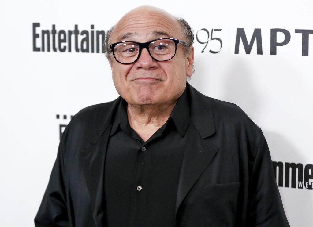 FILE - In this April 7, 2016 file photo, Danny DeVito arrives at the 5th Annual Reel Stories, Real Lives Benefit in Los Angeles. Disney has released its first teaser trailer for Tim Burton's remake of the classic “Dumbo.” The live-action film stars Danny DeVito, Colin Farrell, Alan Arkin, Eva Green and Michal Keaton. Originally released in 1941, “Dumbo” is the story about an elephant with big ears who can fly. (Photo by Rich Fury/Invision/AP, File)