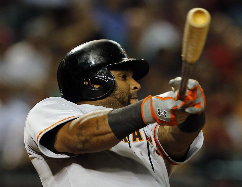 In this Sept. 16, 2014, file photo, San Francisco Giants third baseman Pablo Sandoval (48) bats against the Arizona Diamondbacks in the seventh inning during a baseball game in Phoenix. Sandoval and the Boston Red Sox have agreed to a multiyear contract. (AP Photo/Rick Scuteri, File)