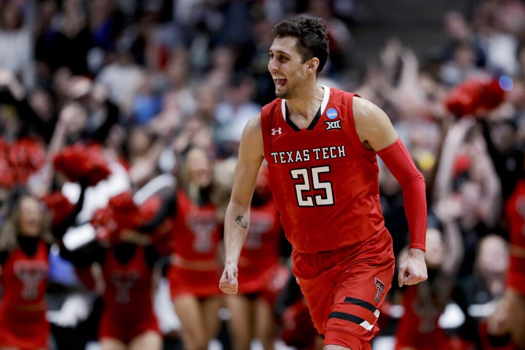 Texas Tech guard Davide Moretti celebrates after scoring against Gonzaga during the second half of the West Region final in the NCAA Tournament, Saturday, March 30, 2019, in Anaheim. (AP Photo/Marcio Jose Sanchez)