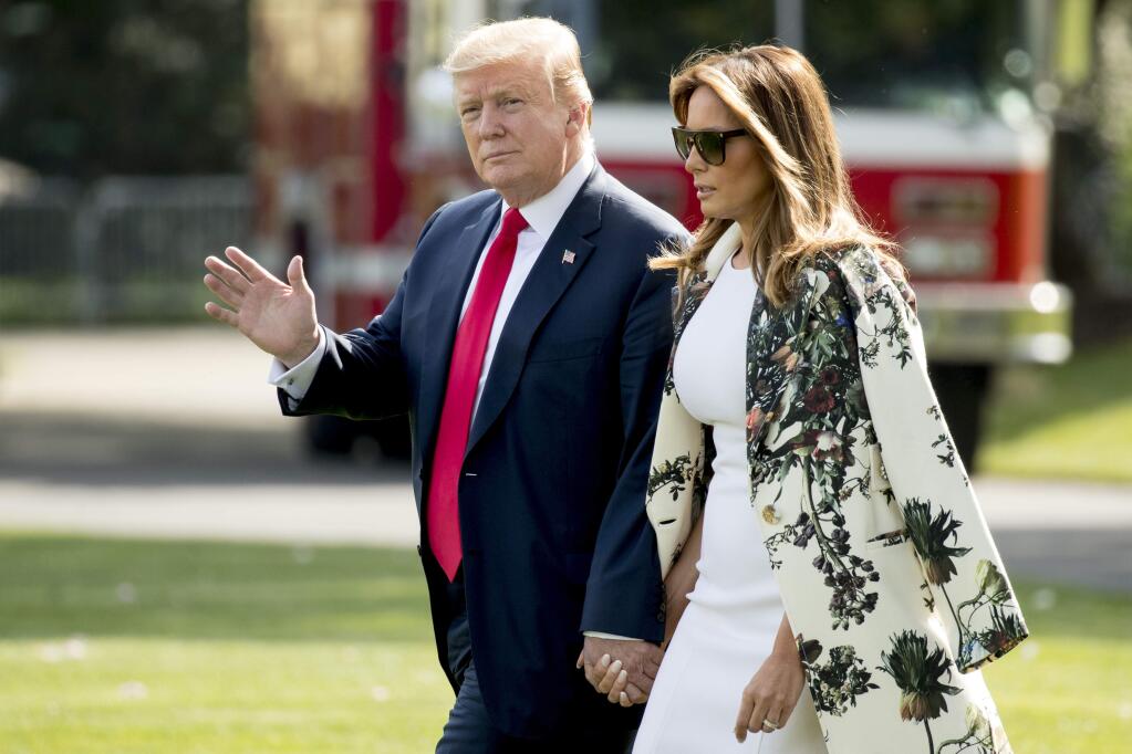 President Donald Trump and first lady Melania Trump walk across the South Lawn of the White House, Thursday, April 18, 2019, to board Marine One for a short trip to Andrews Air Force Base, Md. They are spending the Easter weekend in Florida. (AP Photo/Andrew Harnik)