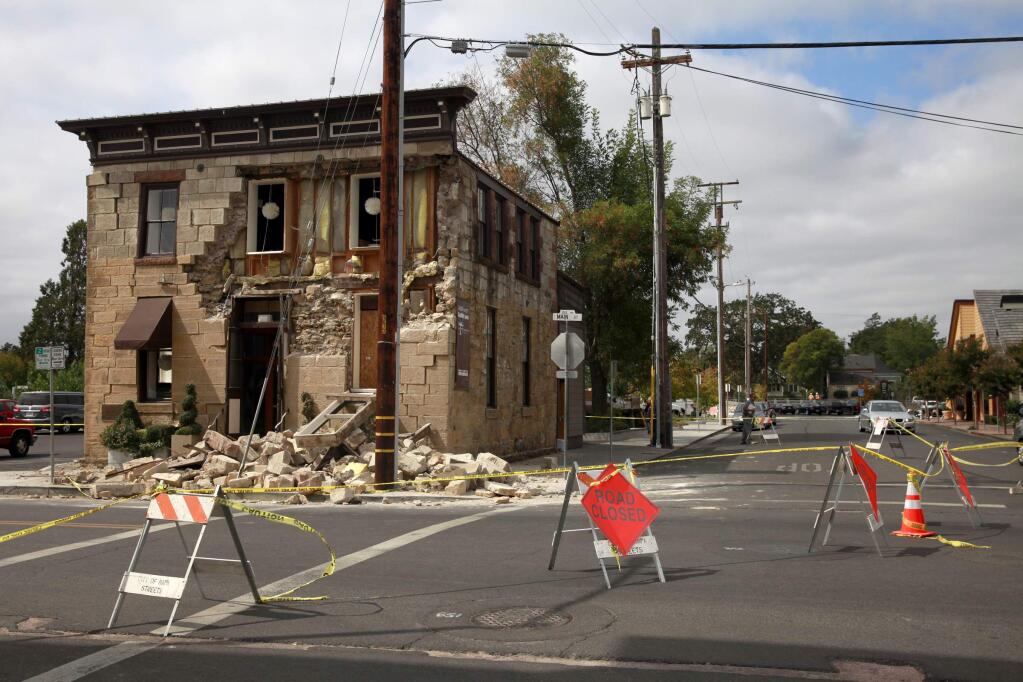 BETH SCHLANKER / The Press DemocratBricks fell from the Pfeiffer building onto the sidewalk below during the Napa earhquake.
