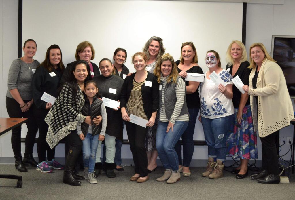 Sonoma Valley's 2017-2018 PTO leaders with their $1,500 stipend from the Red & White Ball, handed out by the Sonoma Valley Education Foundation on Nov. 2 as thanks for providing volunteers for the event.