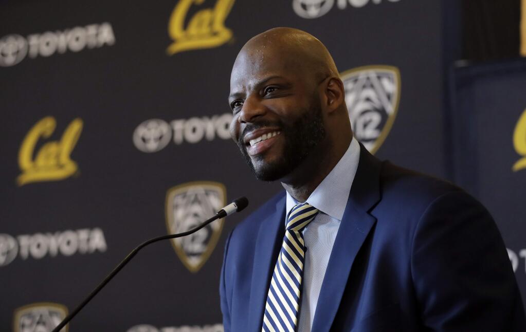Wyking Jones smiles during a press conference to announce his new appointment as California NCAA college men's basketball coach Wednesday, March 29, 2017, in Berkeley, Calif. (AP Photo/Marcio Jose Sanchez)