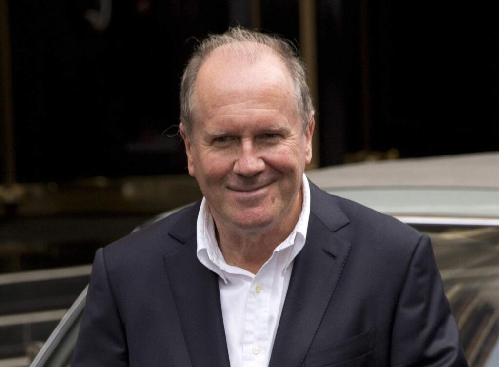 FILE - In this Sept. 23, 2013 file photo, author William Boyd poses outside the Dorchester Hotel in London. Soon after turning out the latest James Bond novel, British author William Boyd agreed to write another thriller based on a world famous brand. The Land Rover. Boyd's nearly 17,000-word story, 'The Vanishing Game,' coming out Wednesday as a free download through Amazon.com, Apple and www.thevanishinggame.com, tells of a 35-year-old British actor named Alec Dunbar and the troubles he encounters when a pretty young woman convinces him to deliver a flask filled with clear liquid from London to Scotland. (AP Photo/Matt Dunham, File)