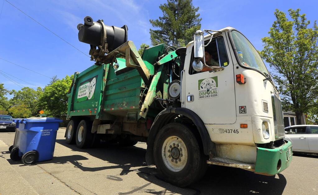 (File photo) A North Bay Corporation truck picks up green waste in Santa Rosa . (JOHN BURGESS/The Press Democrat)
