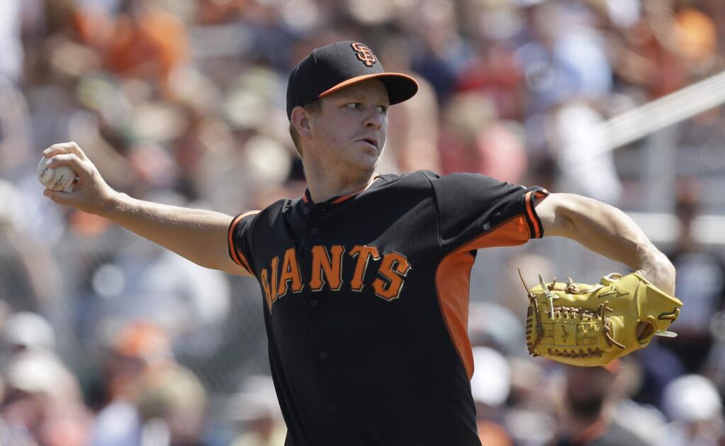 San Francisco Giants' Matt Cain works against the Los Angeles Dodgers in the first inning of a spring training game Sunday, March 29, 2015, in Scottsdale, Ariz. (AP Photo/Ben Margot)