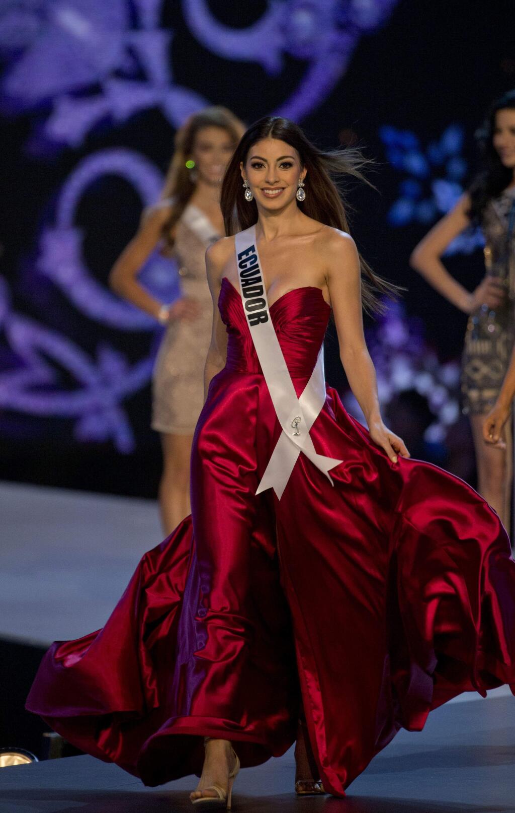 Miss Ecuador Virginia Limongi walks during the swimsuit and evening gown stage of the 67th Miss Universe competition in Bangkok, Thailand, Thursday, Dec. 13, 2018.(AP Photo/Gemunu Amarasinghe)