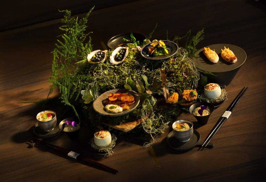 Photos by John Burgess / The Press Democrat)An array of dishes are presented on a bed of wood, moss and ferns at Single Thread Farm-Restaurant-Inn, the new upscale Japanese restaurant in Healdsburg.
