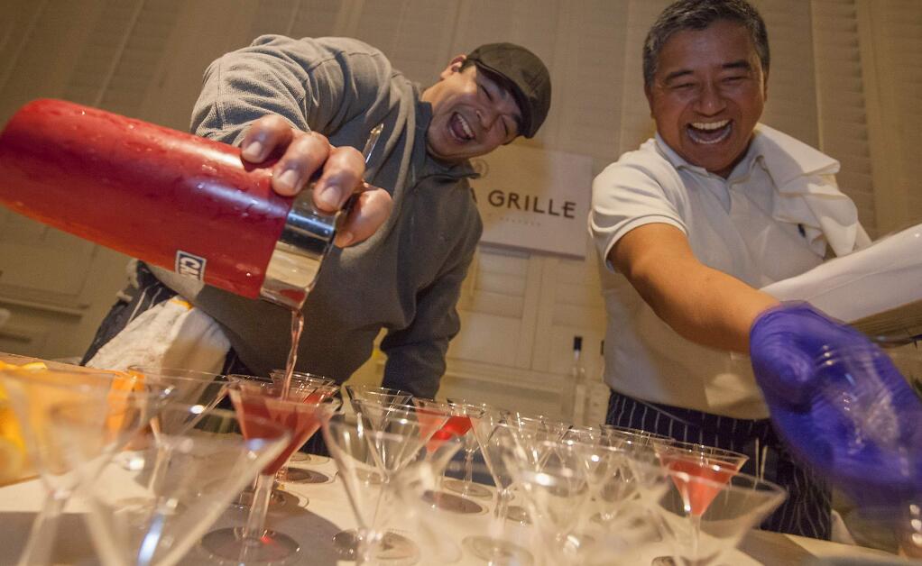 Gerard Stephens and Nima Sherpa, of Sonoma Grille, took great delight in pouring and serving their 'The Winter Chill' martini at the Martini Madness event at Saddles Steakhouse in 2016. (Photos by Robbi Pengelly/Index-Tribune)