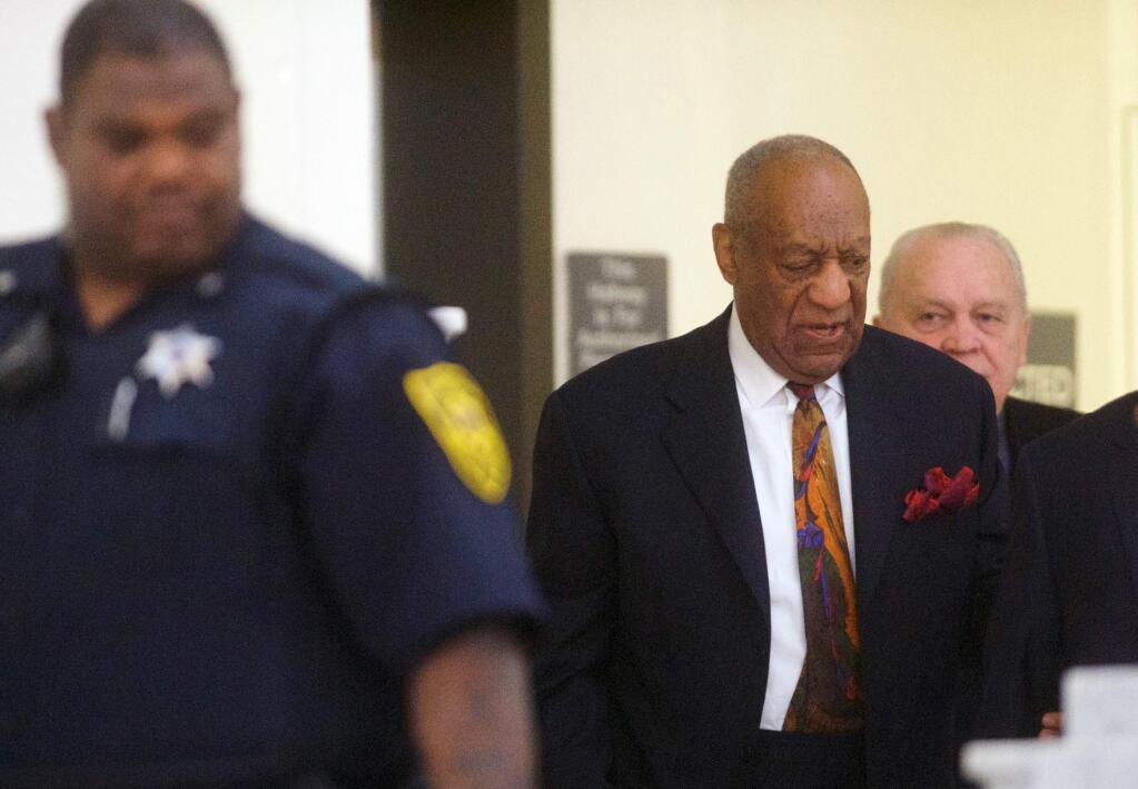 Bill Cosby walks through the Montgomery County Courthouse during a break in his sexual assault retrial, Thursday, April 19, 2018, in Norristown, Pa. (Mark Makela/Pool Photo via AP)