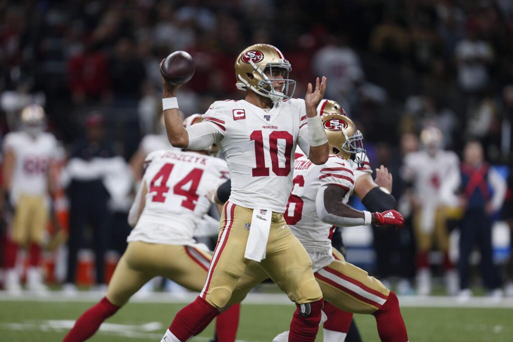 San Francisco 49ers quarterback Jimmy Garoppolo passes in the first half against the New Orleans Saints in New Orleans, Sunday, Dec. 8, 2019. (AP Photo/Butch Dill)