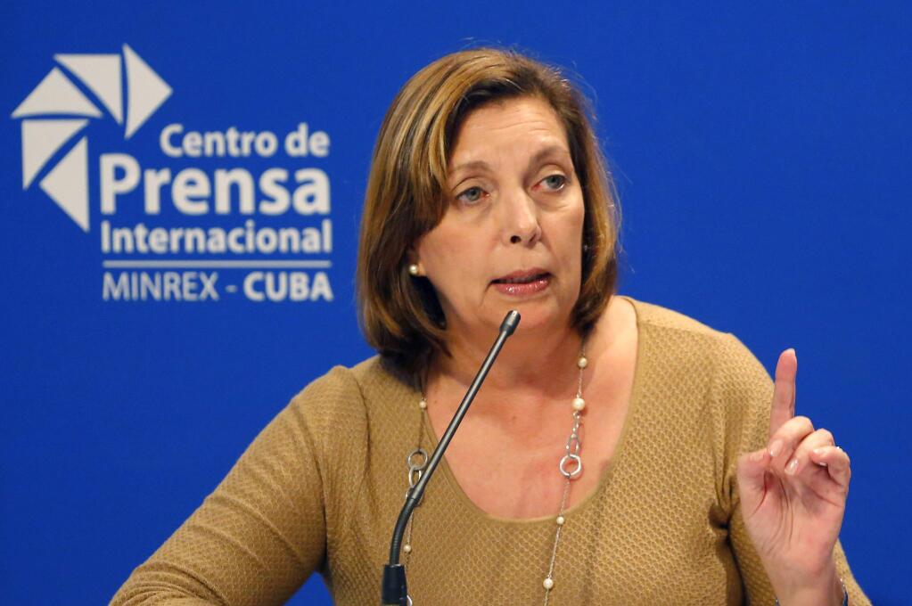 FILE - In this Jan. 12, 2017, file photo, Josefina Vidal speaks to reporters in Havana, Cuba. The Trump administration will press its concerns about unexplained incidents harming American diplomats in Cuba during a meeting in Washington, as the United States considers shuttering its recently re-opened Embassy in Havana. U.S. diplomats will host Cuban official Josefina Vidal, who has been the public face of Cuba's diplomatic opening with the U.S., and other Cuban officials, a State Department official said. (AP Photo/Desmond Boylan, File)