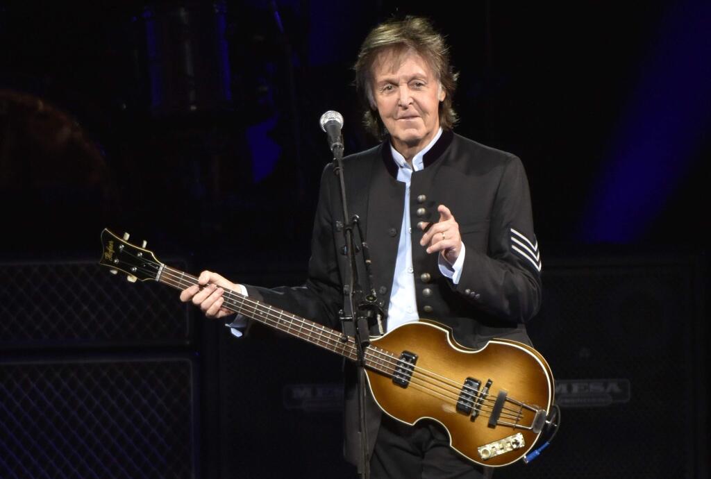 FILE - In this July 26, 2017, file photo, Paul McCartney performs on the One on One Tour at the Hollywood Casino Amphitheatre in Tinley Park, Ill. It was a magical mystery tour as McCartney led James Corden through his hometown during a ‚ÄúCarpool Karaoke‚Äù segment on CBS‚Äô ‚ÄúLate Late Show.‚Äù The program on Thursday, June 21, 2018, wrapped up a weeklong stay in London and the Beatles legend joined Corden for a drive around Liverpool. (Photo by Rob Grabowski/Invision/AP, File)
