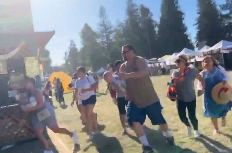 An attendee at the Gilroy Garlic Festival captured the scene on video July 29, as festivalgoers fled at the sound of gunfire.