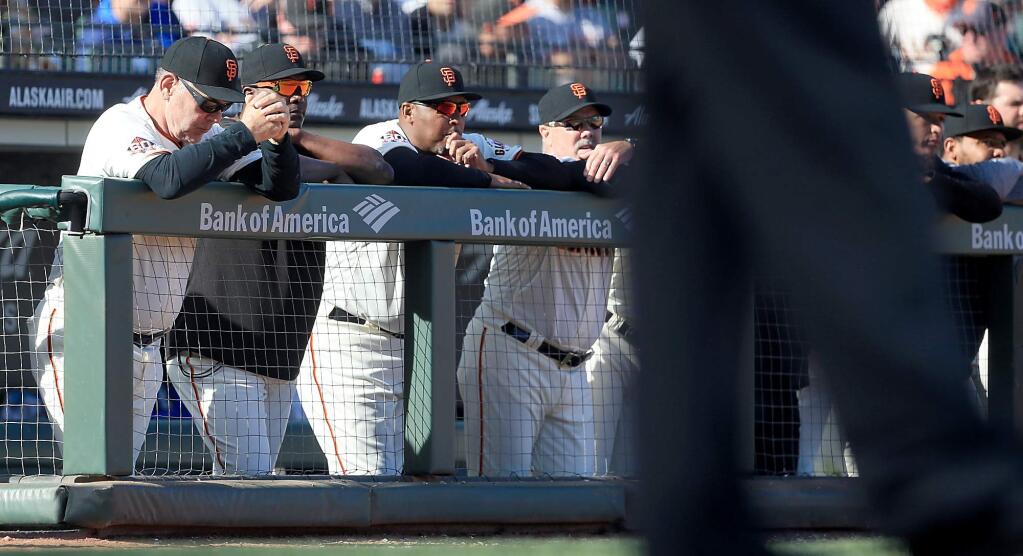 Bruce Bochy reacts as the last out is made during the Giants' 6-4 home opener loss against the Seattle Mariners, Tuesday, April 3, 2018. (Kent Porter / The Press Democrat)