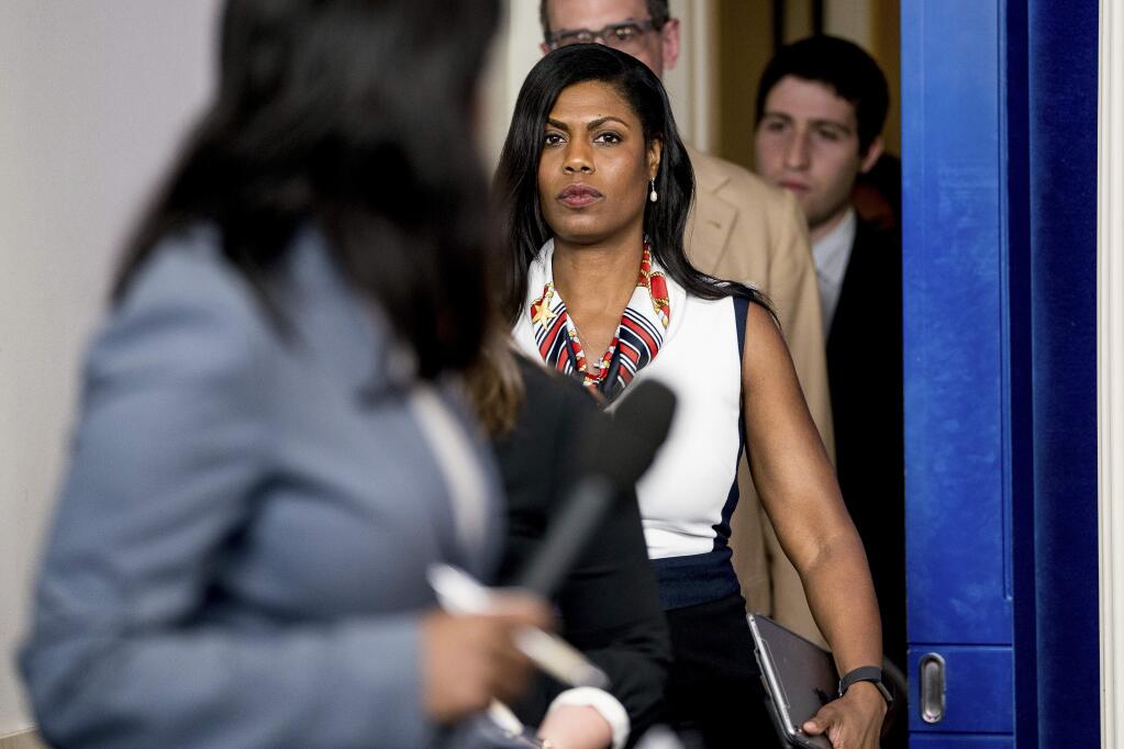 FILE - In this May 30, 2017 file photo, White House Director of communications for the Office of Public Liaison Omarosa Manigault Newman arrives for the daily press briefing at the White House in Washington. The White House says former aide Omarosa Manigault Newman has 'shown a complete lack of integrity' with her criticism of President Donald Trump in her new book, 'Unhinged.' Press secretary Sarah Huckabee Sanders said Tuesday that Trump's tweets referring to Manigault Newman as 'crazed' and a 'dog' reflect his 'frustration' with her comments. (AP Photo/Andrew Harnik, File)