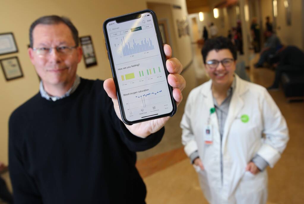 Michael Hatfield the Executive Chairman of Carium, and Dr. Danielle Oryn, the Chief Medical Informatics Officer, have been testing a new health care management app. Photo taken at the Petaluma Health Center in Petaluma on Tuesday, January 29, 2019. (BETH SCHLANKER/ The Press Democrat)