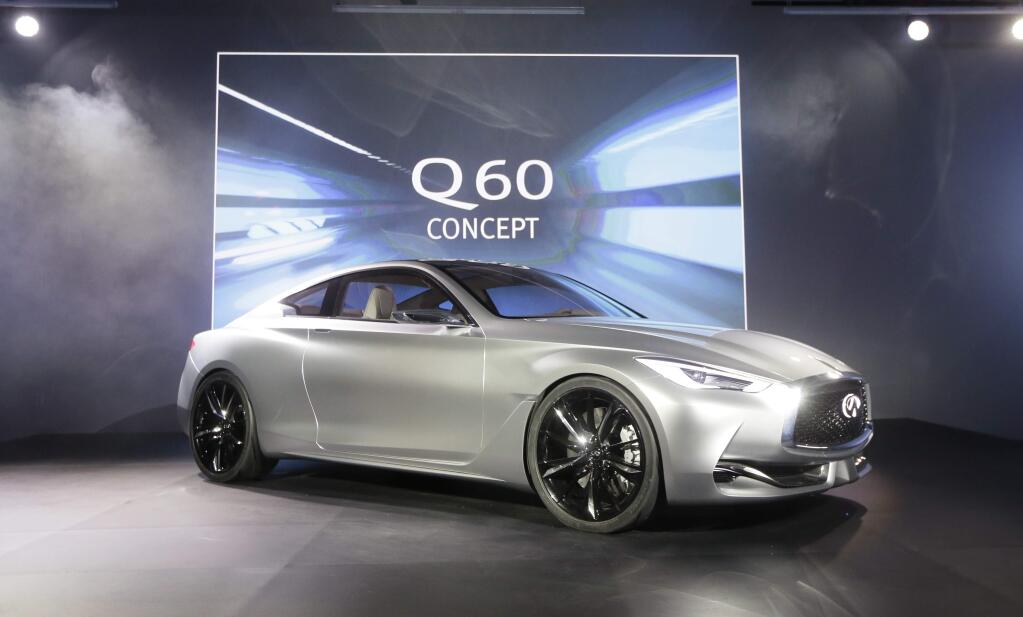 The Infiniti Q60 concept is unveiled at the Museum of Contemporary Art Detroit, Sunday, Jan. 11, 2015 in Detroit. Infiniti says the Q60 that will go on sale next year will be strongly influenced by the Q60 concept. (AP Photo/Carlos Osorio)