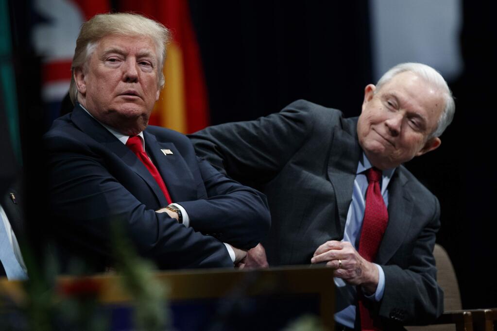 President Donald Trump sits with Attorney General Jeff Sessions during the FBI National Academy graduation ceremony Friday in Quantico, Virginia. (EVAN VUCCI / Associated Press)