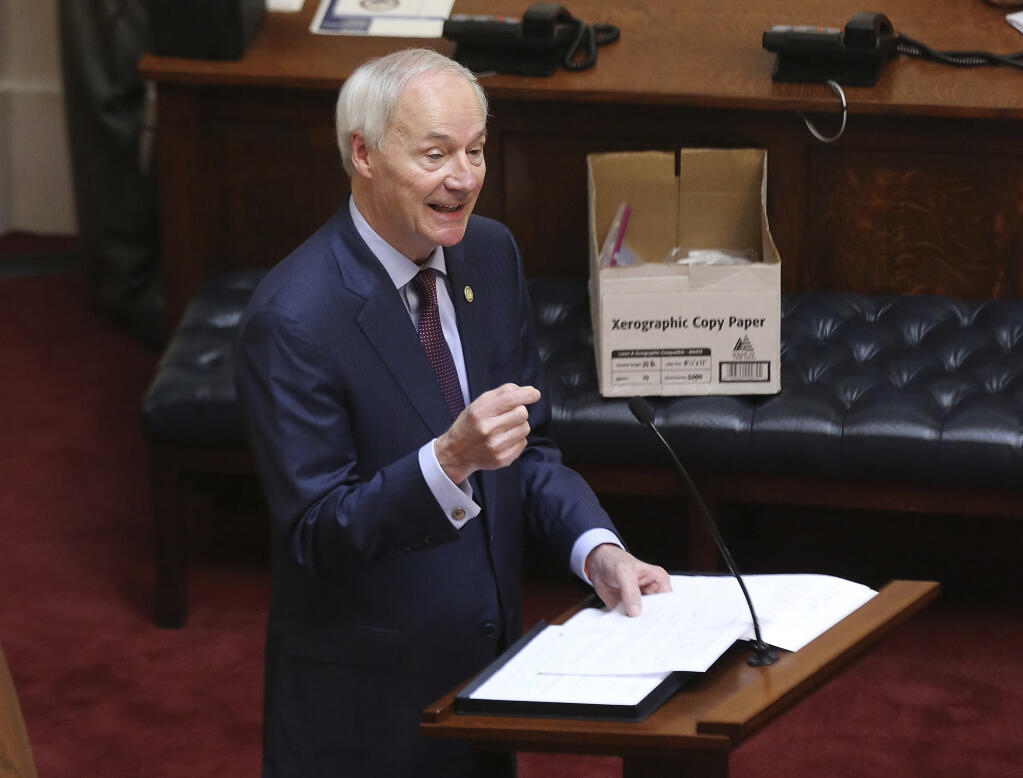 Arkansas Gov. Asa Hutchinson gives the State of the State on April 8, 2020, in the senate chamber of the state Capitol in Little Rock, Arkansas. Hutchinson vetoed legislation that would have made his state the first to ban gender confirming treatments for transgender youth, but today the legislature overrode that veto. (Tommy Metthe / Arkansas Democrat-Gazette)