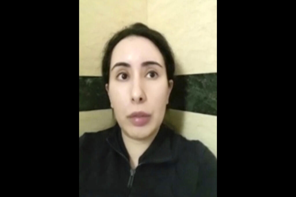 FILE - This undated file image taken from video in an unknown location shows Sheikha Latifa bint Mohammed Al Maktoum speaking into a mobile phone camera. Sheikha Latifa, who has been the subject of concern from a United Nations panel after being seized trying to flee the sheikhdom in 2018, appeared in a social media post Monday, June 21, 2021, that described her as being in Spain on a "European holiday." (#FreeLatifa campaign, Tiina Jauhiainen/David Haigh via AP, File)