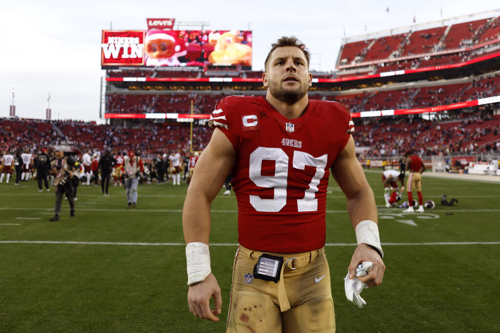 49ers defensive end Nick Bosa walks off the field after Saturday’s win over the Washington Commanders in Santa Clara. (Jed Jacobsohn / ASSOCIATED PRESS)