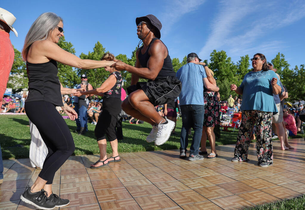 Gayle and Emmett Brinson dance to the music at a recent Thursday Night Concert on the Windsor Town Green on Thursday, June 2, 2022. (Christopher Chung/The Press Democrat)
