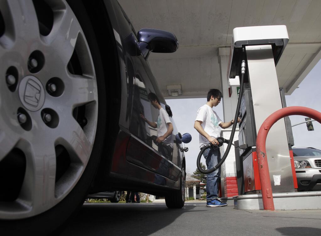 FILE - A motorist fuels up at a gas station in Santa Cruz, Calif., Monday, March 7, 2011. A leak in a fuel pipeline facility in California has forced a shutdown of deliveries of gasoline and diesel from the Los Angeles to areas including Las Vegas and Phoenix. (AP Photo/Marcio Jose Sanchez, File)