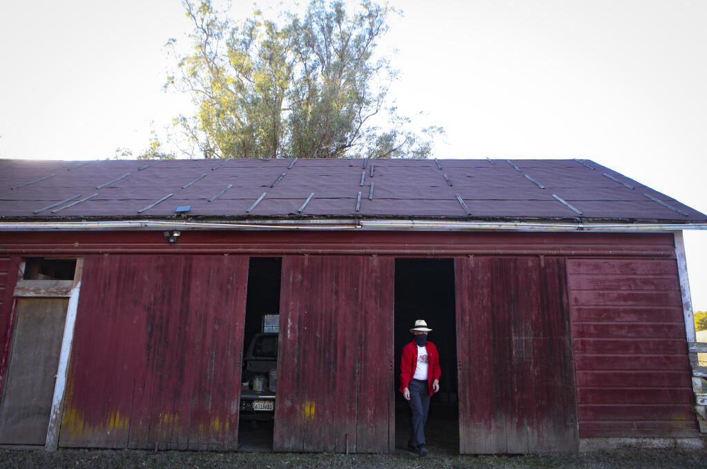 Greg Colvin walks through one of the barns located at the historic Scott Ranch on D Street and Windsor on December 7, 2020. (CRISSY PASCUAL/ARGUS-COURIER STAFF)