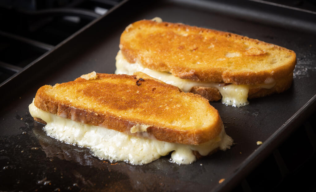 Emily O'Conor of Merchant & Monger uses three cheeses, lots of butter and a long, slow cooking time for her Grilled Cheese Sandwiches Friday, Feb. 10, 2023.  (John Burgess/The Press Democrat)